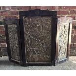 A 19th century Persian stained-wood and brass three-fold table screen, the frame blind-fret carved