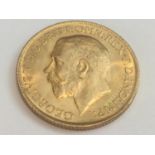 King George V sovereign, 1915, obv bare head, rv George & Dragon, weight 8.0g, condition VF.