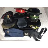 Fifteen various peaked caps / hats including Royal Scots Dragoon Guards, Queens Lancashire Regiment,