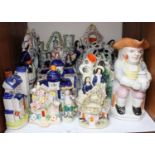 SECTION 21. A shelf of ceramics including Staffordshire flatback figures and character jugs etc.