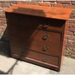 An Edwardian stained walnut chest of two short over three long drawers, shaped brass handles,