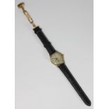 A gents Smiths Deluxe wristwatch, the circular dial with Arabic numerals denoting hours and
