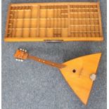 A collector's / specimen cabinet drawer, 83cm wide, together with a Balalaika (2)