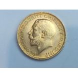King George V sovereign, 1925, obv bare head, rv George & Dragon, weight 8.0g, condition VF.