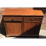 A reproduction mahogany drinks cupboard with slide out tray, two drawers with metal handles above