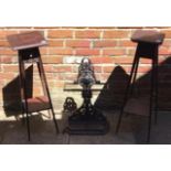 A Victorian cast iron umbrella stand cast with relief cast roundel featuring a bird of prey eating