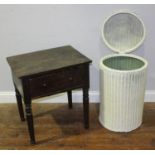 A white painted Lloyd Loom wash basket, together with a stained oak bedside table with single