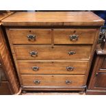 An Edwardian walnut veneered chest of two short and three long graduated drawers, original