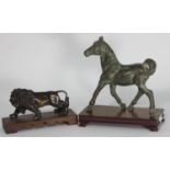 A bronze figure of a trotting foal, on fitted wooden plinth, approx. 17cm high, together with a cast