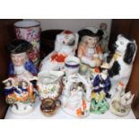 SECTION 22. A shelf of ceramics including Staffordshire dogs, character jugs, large twin-handled