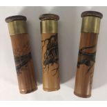 Three hand made bamboo shot tubes, illustrated in Indian ink scenes of fish and signed by Paul Cook,