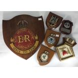 A large shield plaque 'Royal Military Academy Sandhurst Serve to Lead', together with a ceramic