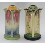 Two Art Deco Myott Son & Co. pottery 'Torpedo' vases, one hand painted with a pink, blue and green