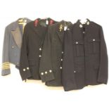 A Royal Marines coat, together with two Royal Navy uniforms comprising jackets and trousers and an