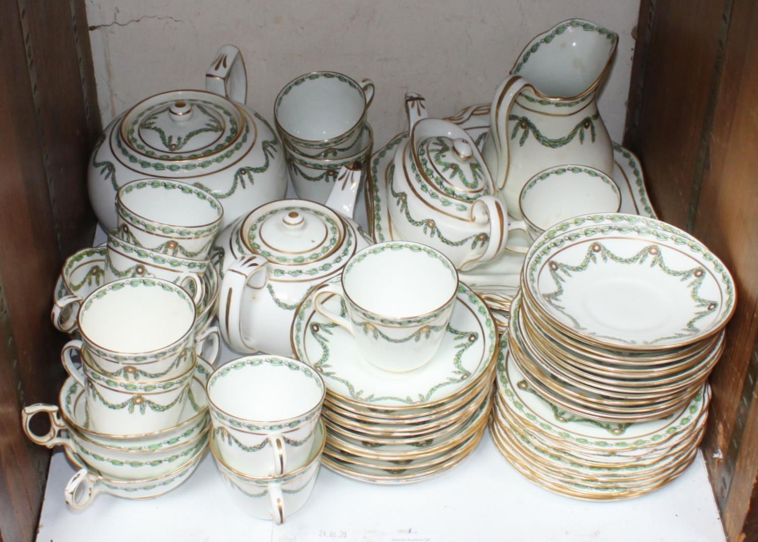 SECTION 24. A large quantity of Hammersley No. 13698 tea wares decorated with green swags of