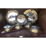 A pair of brass faux porthole mirrors, together with a Ship's Time quartz porthole clock (lacking