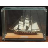 A model ship of SS Clydesdale, in glazed display cabinet with plaque reading 'SS Clydesdale 50 tons,