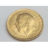 King George V sovereign, 1914, obv bare head, rv George & Dragon, weight 8.0g, condition VF.