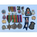 A WW2 Pacific Star, Defence Medal and War Medal, together with the corresponding miniatures and