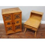 A small oak cupboard with two carved panel doors enclosing shelves, raised on shaped bracket feet,