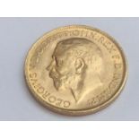 King George V sovereign, 1911, obv bare head, rv George & Dragon, weight 8.0g, condition VF.