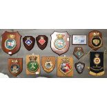 A collection of ten assorted ships badges including 'Yarmouth', 'Sultan', 'Tiger', 'Decoy' and '
