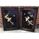 A pair of Japanese Meiji period ivory relief carved lacquer panels, scenes of birds of prey, trees