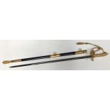 An ERII British naval officers dress sword, the blade with crowned anchor amidst scrolls, gilt metal