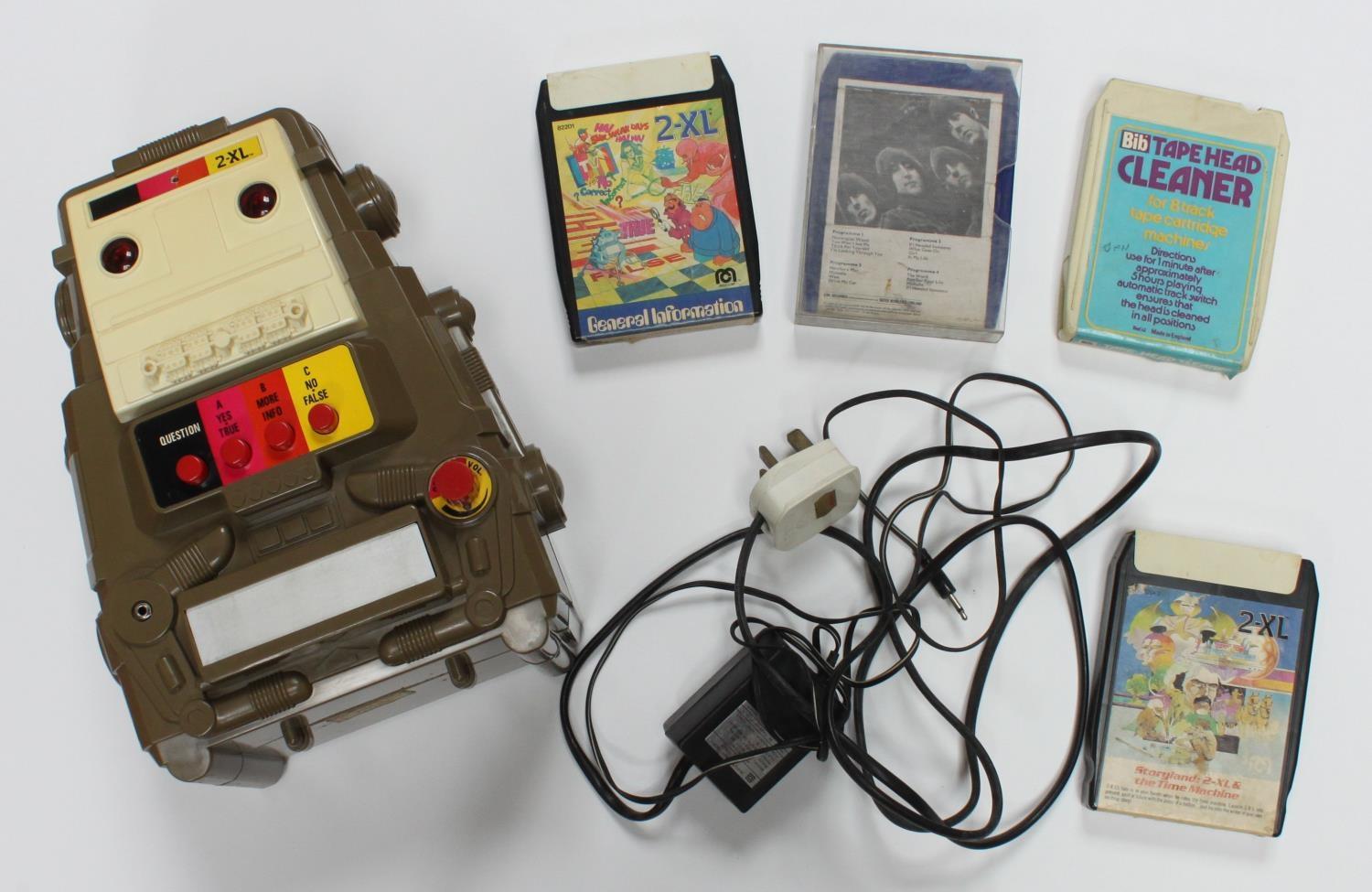 A 1978 Mego Corp 2-XL educational toy robot with 8 track tape player, together with a small