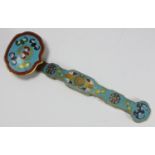 A Chinese cloisonne and brass Ruyi (sceptre), enamelled with coloured bats and geometric shapes to