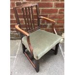 A child's chair upholstered in green velour, converted from a high chair, together with a