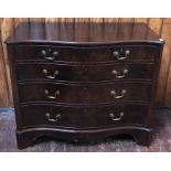 A 20th century walnut serpentine chest/ mule chest, with hinged top enclosing storage space and faux