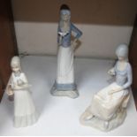 SECTION 28. Three various Lladro style Spanish porcelain figurines, two of ladies holding birds