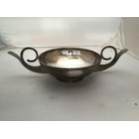 A large two-handled silver bowl (marked 925 Sterling, tests as sterling silver) with ornate,