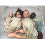 Three various Armand Marseille dolls including a black baby doll No. 351/3 1/2K, approx. 40cm and