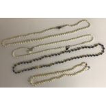 Four various cultured pearl necklaces including two graduated rows of pearls, one with pearl pendant