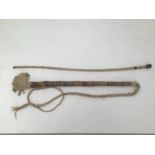 A riding crop made from a vertebrae, together with a handmade wooden and bark twisted crop/whip (2)