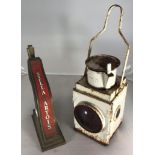 A British Rail railways lamp with red lens and swing handle, together with a vintage brass Stella