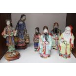 SECTION 13. A set of three ceramic Oriental ladies in varying poses (one lacking fingers on one