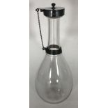 A Victorian silver double collared water carafe, with glass pear shaped body and star-etched base,