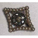 A 19th century diamond and seed pearl brooch with central rose-cut diamond spreading approx. 0.33