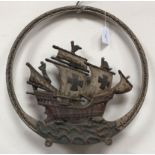 A cast iron circular plaque with chain and anchor rim and galleon at sea, rear fixings, 39cm