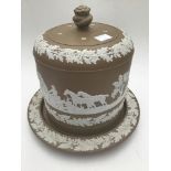 A Wedgwood Jasperware style brown Stilton dish and cover, with oak leaf and acorn border and