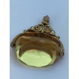 Victorian 9ct gold citrine fob spinner. Hallmarked Birmingham 1898. Weighs 33.7 grams. Stone