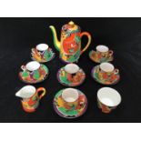 An art deco Grimwades Royal Winton 'Jazz' pattern coffee set comprising six coffee cans and saucers,