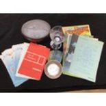 A quantity of Cunard memorabilia including a metal embossed oval tin 'The Cunarder 534', a white me