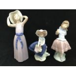 Two Lladro figures of girls 'Trying on a Straw Hat' no. 5011, 27cm high, 'Pretty Pickings' no.