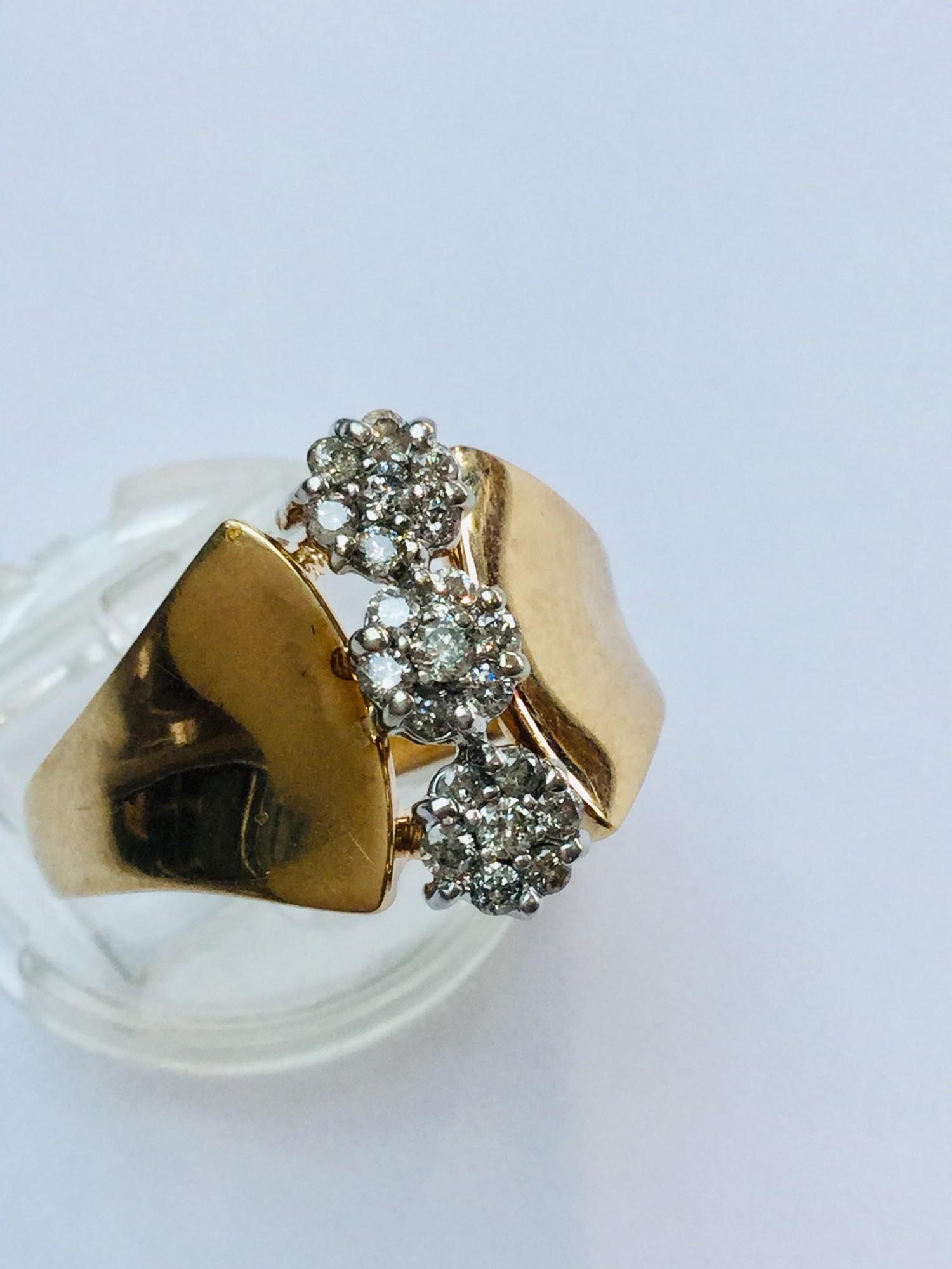 A 10ct yellow gold Tri-cluster dress ring. The ring is set with 21 x small diamonds in a claw set