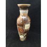 An unusual Doulton Lambeth vase of baluster form with applied relief moulded panels depicting a