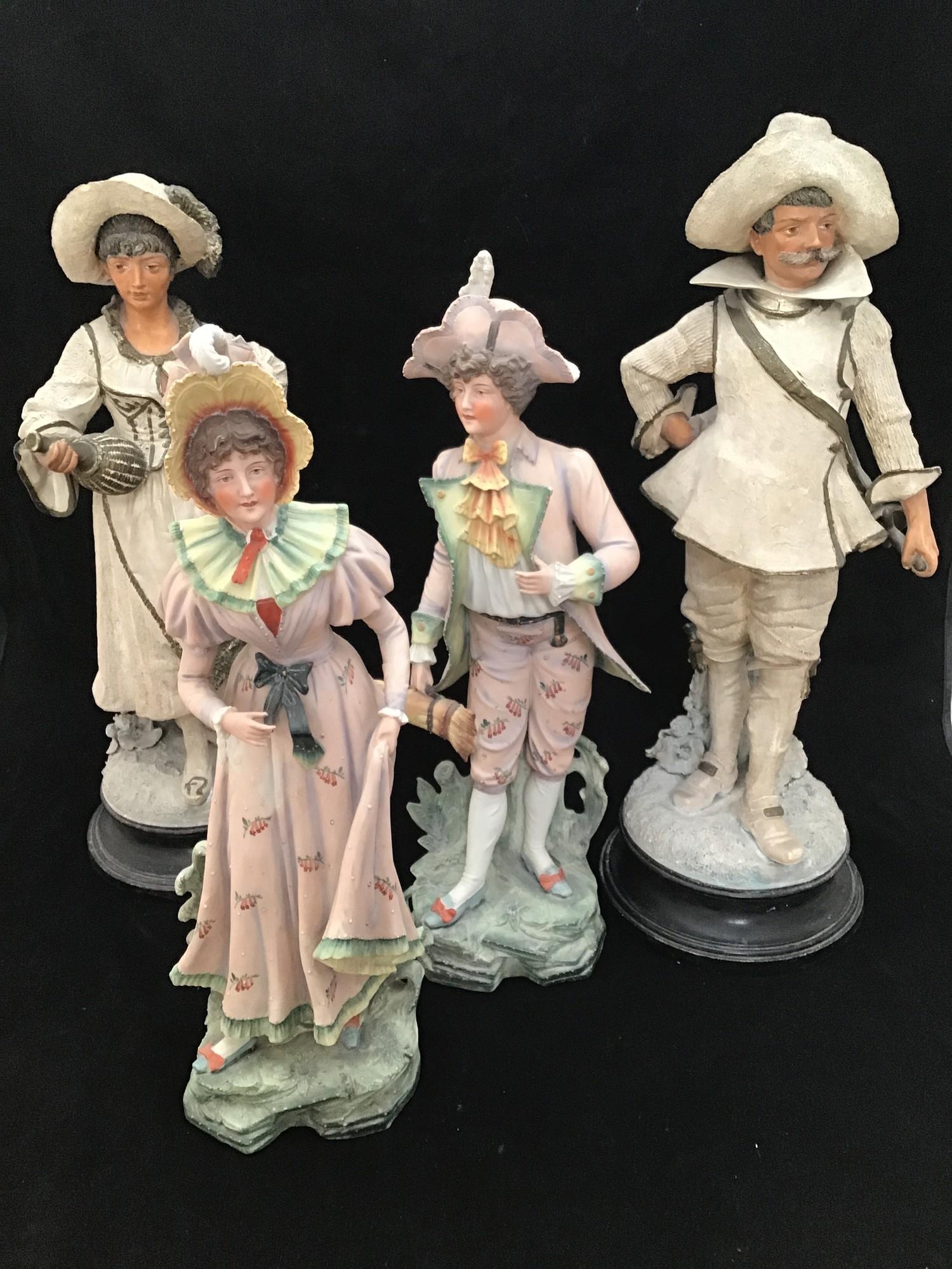 A pair of large pottery figures of a European gentleman with sword and a lady in traditional dress - Image 2 of 3